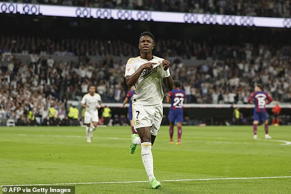 Real Madrid's Brazilian forward #07 Vinicius Junior celebrates scoring from the penalty spot during the Spanish league football match between Real Madrid CF and FC Barcelona at the Santiago Bernabeu stadium in Madrid on April 21, 2024. (Photo by OSCAR DEL POZO / AFP) (Photo by OSCAR DEL POZO/AFP via Getty Images)