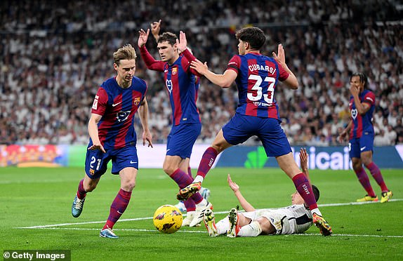 MADRID, SPAIN - APRIL 21: Lucas Vazquez of Real Madrid is fouled by Pau Cubarsi of FC Barcelona which results in a penalty being awarded during the LaLiga EA Sports match between Real Madrid CF and FC Barcelona at Estadio Santiago Bernabeu on April 21, 2024 in Madrid, Spain. (Photo by David Ramos/Getty Images)