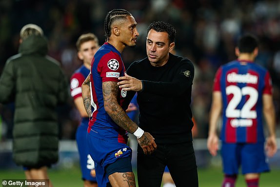 BARCELONA, SPAIN - APRIL 16: Raphinha and head coach Xavi Hernandez of FC Barcelona greet each other during the UEFA Champions League Quarter-final second-leg match  between FC Barcelona and Paris Saint-Germain FC at Estadio Olimpico de Montjuic on April 16, 2024, in Barcelona, Spain. (Photo By Irina R. Hipolito/Europa Press via Getty Images)