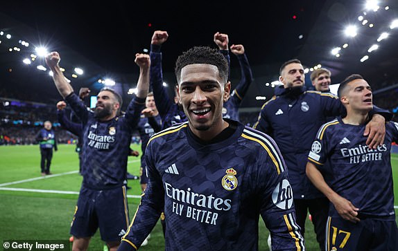 MANCHESTER, ENGLAND - APRIL 17:  Jude Bellingham of Real Madrid celebrates with team mates after the UEFA Champions League quarter-final second leg match between Manchester City and Real Madrid CF at Etihad Stadium on April 17, 2024 in Manchester, England. (Photo by Alex Livesey - Danehouse/Getty Images)