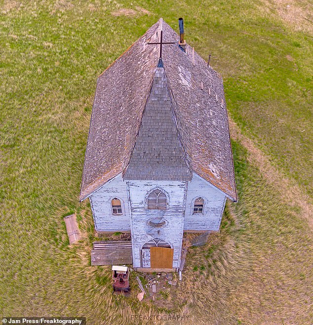 This is just one of many ghost towns in Saskatchewan ¿ as there are approximately 140, many of which were abandoned during the 20th century, The church is seen from above
