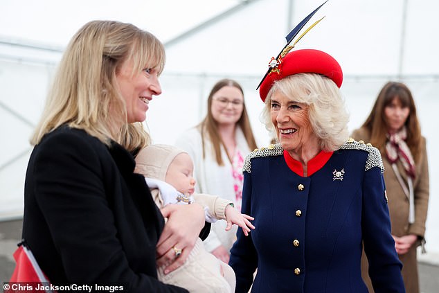Camilla meets families at a reception and looked in her element with a small baby