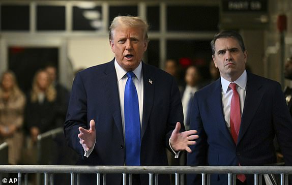Former President and Republican presidential candidate Donald Trump, next to lawyer Todd Blanche, arrives at Manhattan Criminal Court in New York, Monday, April 22, 2024. (Angela Weiss/Pool Photo via AP)