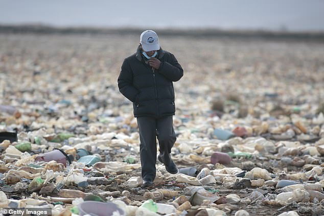 A new film, called 'Plastic People,' has revealed the treacherous path of the tiny particles from sand on beaches to crossing the blood-brain barrier in humans Above, plastics pollution near Bolivia's Tagarete River in 2021