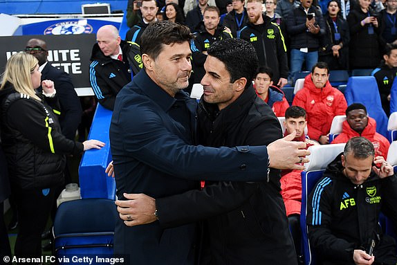 LONDON, ENGLAND - OCTOBER 21: Mauricio Pochettino, Manager of Chelsea, embraces Mikel Arteta, Manager of Arsenal, prior to the Premier League match between Chelsea FC and Arsenal FC at Stamford Bridge on October 21, 2023 in London, England. (Photo by Stuart MacFarlane/Arsenal FC via Getty Images)