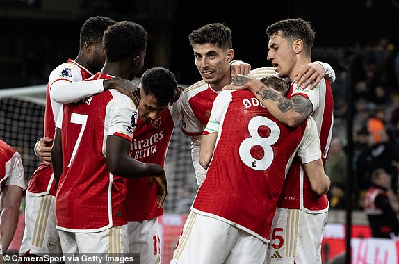 WOLVERHAMPTON, ENGLAND - APRIL 20: Arsenal's 2nd goal scorer Martin Odegaard (#8) is congratulated by team mates Kai Havertz (centre) and Jakub Kiwior (right) during the Premier League match between Wolverhampton Wanderers and Arsenal FC at Molineux on April 20, 2024 in Wolverhampton, England.(Photo by Andrew Kearns - CameraSport via Getty Images)