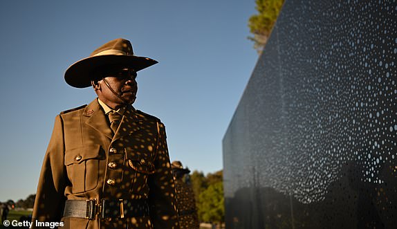 CANBERRA, AUSTRALIA - APRIL 25: NORFORCE soldier from the Arnhem Squadron, Private Mali Djarrbal poses for photographs after the ATSIVSA ceremony at "For Our Country" Aboriginal and Torres Strait Islander memorial after the Dawn Service was held at the Australian War Memorial on April 25, 2024 in Canberra, Australia. Anzac Day is a national holiday in Australia, traditionally marked by a dawn service held during the time of the original Gallipoli landing and commemorated with ceremonies and parades throughout the day. Anzac Day commemorates the day the Australian and New Zealand Army Corp (ANZAC) landed on the shores of Gallipoli on April 25, 1915, during World War 1. (Photo by Tracey Nearmy/Getty Images)