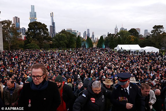 Crowds are seen walking up the steps to the Shrine of Rememberence during the Anzac Day Dawn Service in Melbourne, Thursday, April 25, 2024. (AAP Image/Con Chronis) NO ARCHIVING