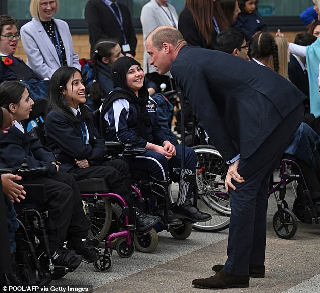 Prince William speaks to school children during his visit to Rowley Regis today