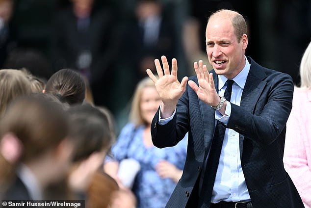 It appeared William was a hit with the schoolchildren as he gave them a double wave upon leaving