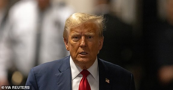 Former US President Donald Trump arrives at Manhattan criminal court in New York, US, on Thursday, April 25, 2024. Trump faces 34 felony counts of falsifying business records as part of an alleged scheme to silence claims of extramarital sexual encounters during his 2016 presidential campaign. Jeenah Moon/Pool via REUTERS