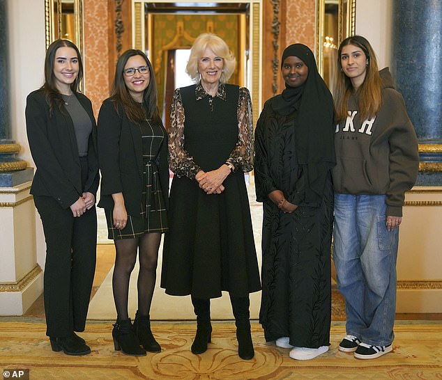 Camilla, centre, poses for a photograph with young pioneer 'Changemakers' from left, Imi, Maya, Almas, and Lybah