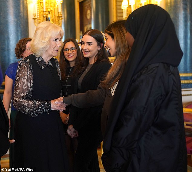 Queen Camilla, Patron of SafeLives, meets with young pioneer 'Changemakers', from the SafeLives charity, at Buckingham Palace