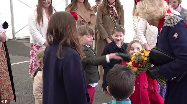 The young fans then shook Camilla's hands, before she remarked: 'You've got cold fingers, you'll have to warm those up'