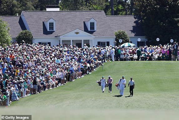 AUGUSTA, GEORGIA - APRIL 13: Tiger Woods of the United States and Tyrrell Hatton of England walk off the first tee during the third round of the 2024 Masters Tournament at Augusta National Golf Club on April 13, 2024 in Augusta, Georgia. (Photo by Maddie Meyer/Getty Images)