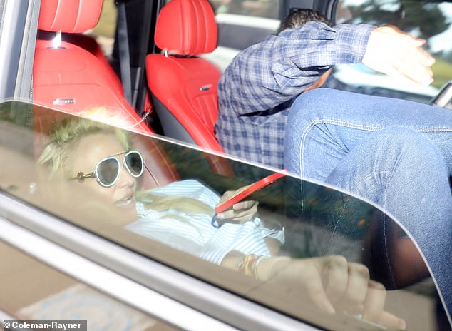 The photo of Britney just last weekend sitting in a car, her foot up against a shattered windshield, evoked that very era of Britney, then at her lowest.