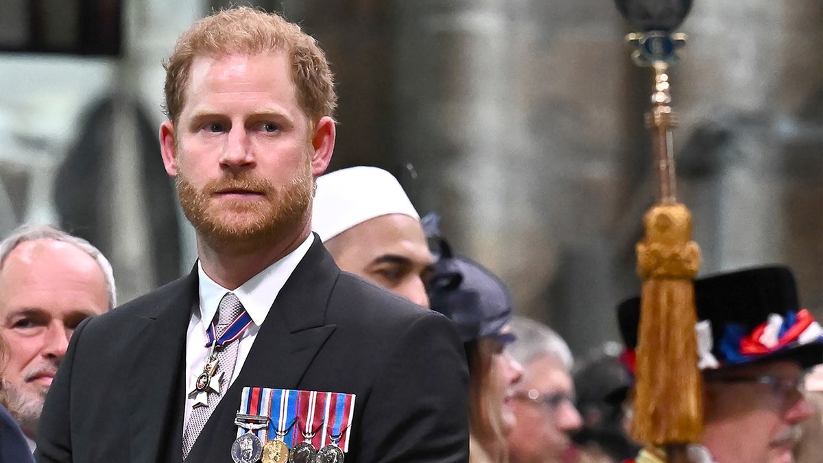 Prince Harry looking pensive at his father's coronation