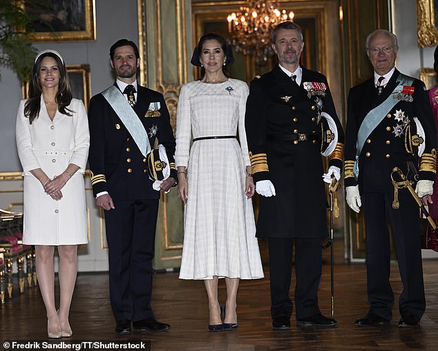 Princess Sofia, Prince Carl Philip, Queen Mary, King Frederik X, and King Carl XVI Gustaf pose for a photograph in the Hall of State at the Royal Palace in Stockholm, Sweden
