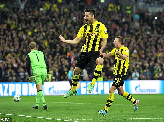 Borussia Dortmund's IIkay Gundogan celebrates scoring his teams first goal of the game from the penalty spot during the UEFA Champions League Final at Wembley Stadium, London. PRESS ASSOCIATION Photo. Picture date: Saturday May 25, 2013. See PA Story SOCCER Final. Photo credit should read: Martin Rickett/PA Wire. RESTRICTIONS: Use subject to restrictions. Editorial use only when not based solely on any team and/or any player(s) and/or devoted to the UEFA Champions League. No commercial use. Call 44 (0)1158 447447 for further information.