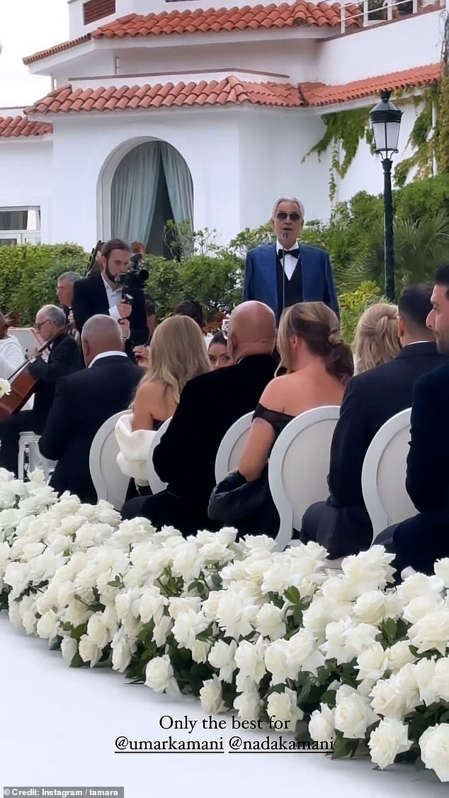 The Italian tenor was joined by a full orchestra as the bride walked down a beautiful aisle filled with white roses