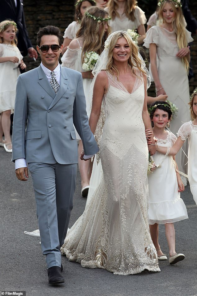 Kate Moss wears a John Galliano gown for her wedding to Jamie Hince on July 1, 2011 in Southrop