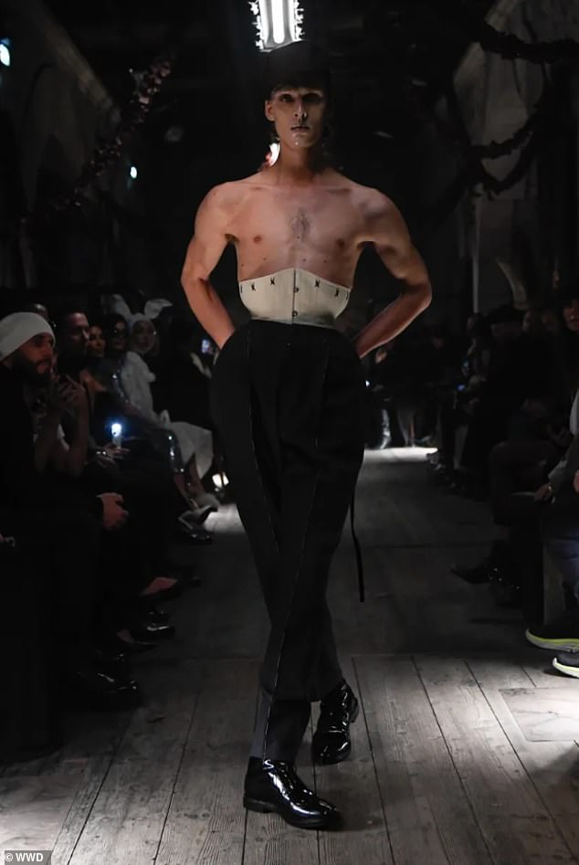 The first look from Maison Margiela's Spring 2024 collection featured a male model wearing a corset