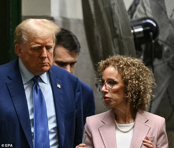 epa11330036 Former US President Donald Trump speaks with attorney Susan Necheles (R) as he walks to the courtroom following a break in his hush money trial at the Supreme Court of the State of New York, in New York City, USA, 09 May 2024. Trump is facing 34 felony counts of falsifying business records related to payments made to adult film star Stormy Daniels during his 2016 presidential campaign.  EPA/ANGELA WEISS / POOL