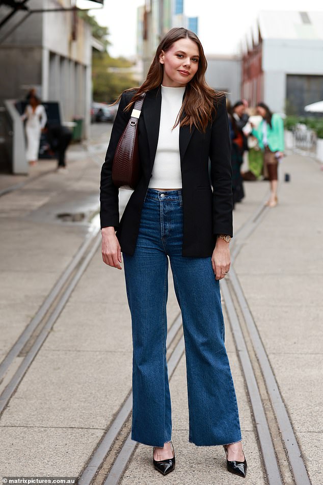 Lucia Hawley (pictured) was casually cool in a crisp white top under a cropped black blazer paired with bell bottom jeans