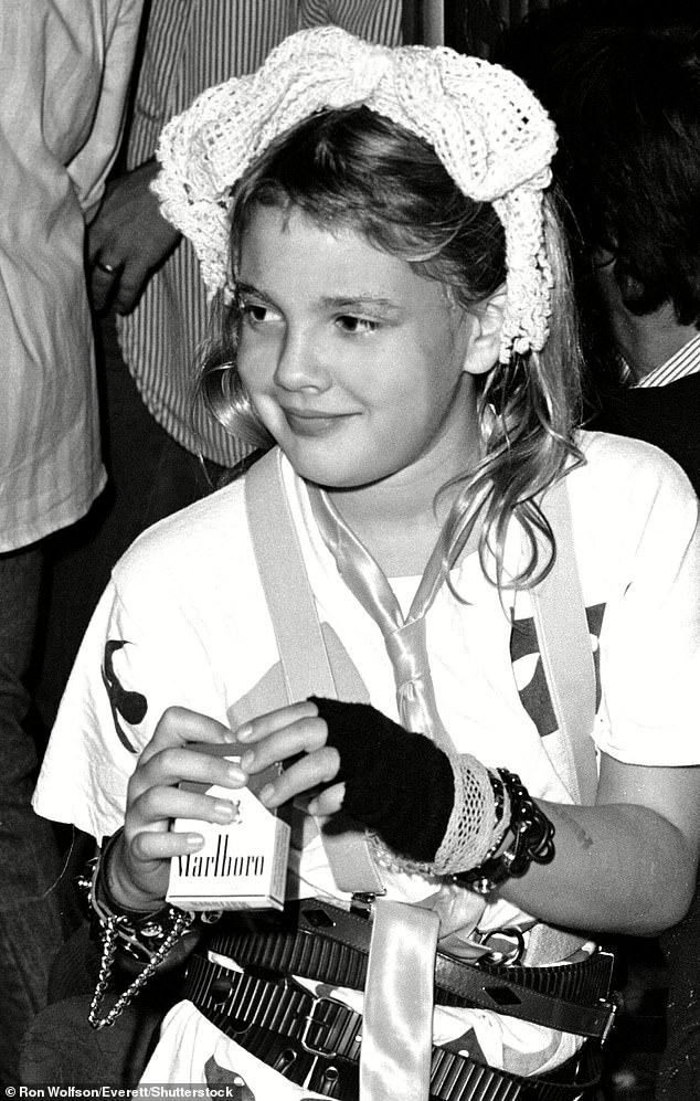 Who among Drew's generation can ever forget those infamous photos of her as a small child at Studio 54, lighting Stephen King's cigarette or sitting disconsolate at a table full of cocktails, head in her hand? (Above) Drew Barrymore attends party at The Palace in Hollywood in 1985