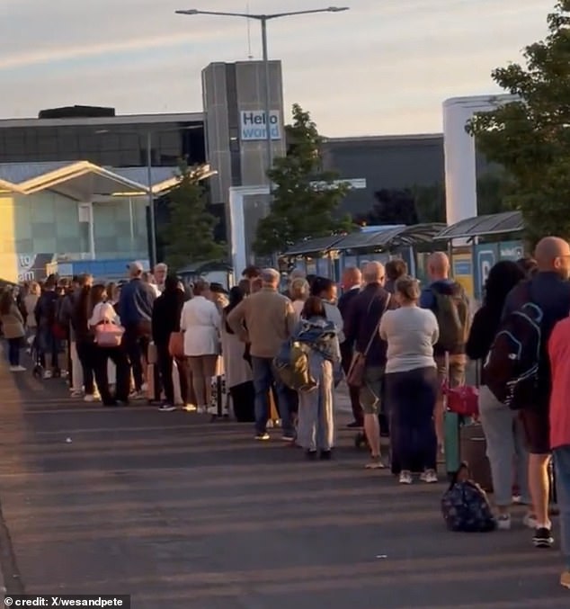 Long queues outside Birmingham airport can be seen on Sunday in a video posted to X
