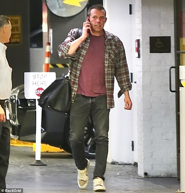 And just minutes later, Ben was also seen strolling through the parking garage as he also arrived to their office