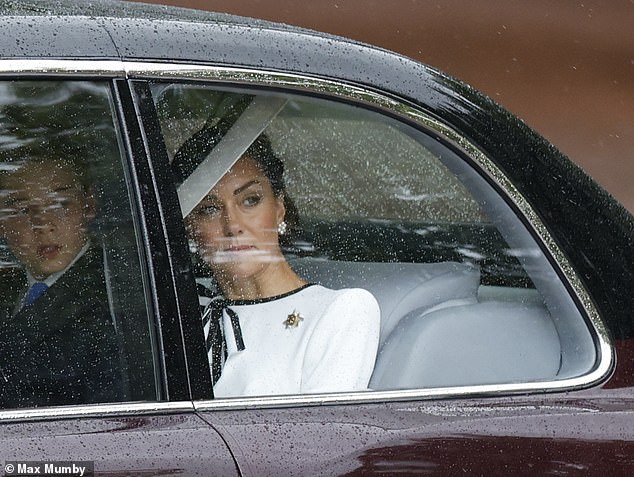 The Princess of Wales looks out at the rain as she arrives at Buckingham Palace today