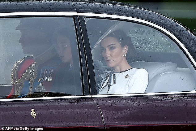 The Princess of Wales looks out at the rain as she arrives at Buckingham Palace today