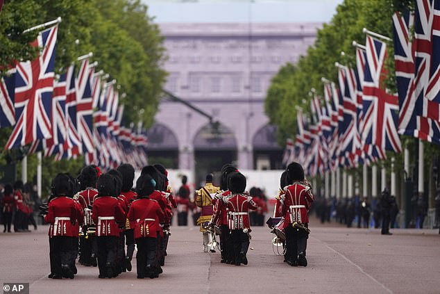 Members of the Irish Guards march along The Mall towards Horse Guards Parade today