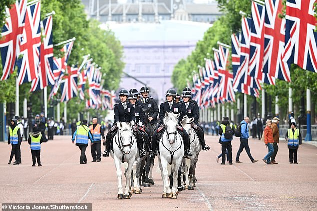 Police on horseback down The Mall ahead of Trooping the Colour in London today