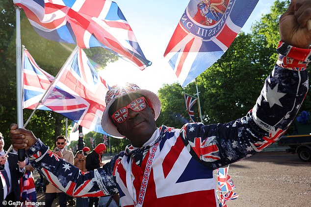Royal fan Joseph Afrane stands on The Mall this morning ahead of Trooping the Colour