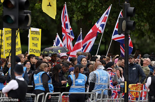 Republic protesters hold up placards on The Mall ahead of Trooping the Colour this morning