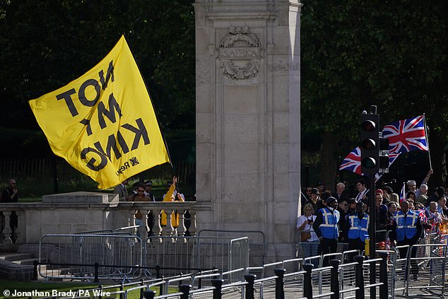 Protesters from the Republic group with a flag saying 'Not My King' in Westminster today