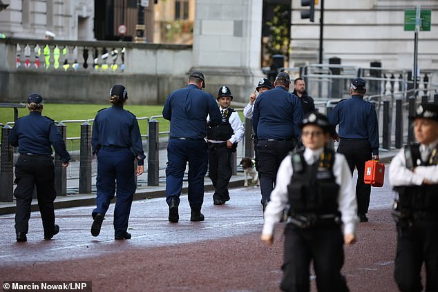 A team of police officers on patrol in Westminster this morning ahead of Trooping The Colour