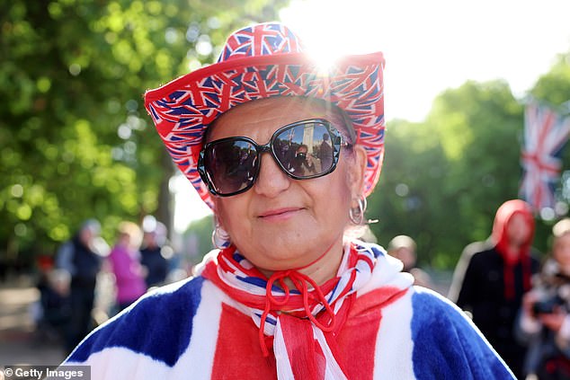 Royal fan Minerva Halil stands on The Mall this morning ahead of Trooping the Colour