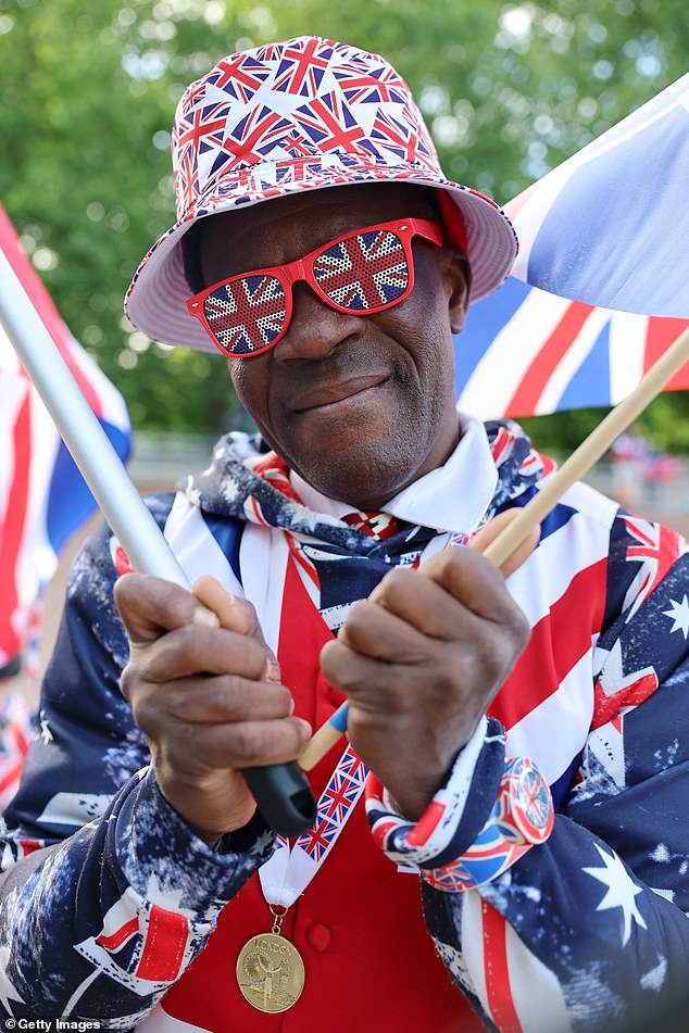 Royal fan Joseph Afrane stands on The Mall this morning ahead of Trooping the Colour