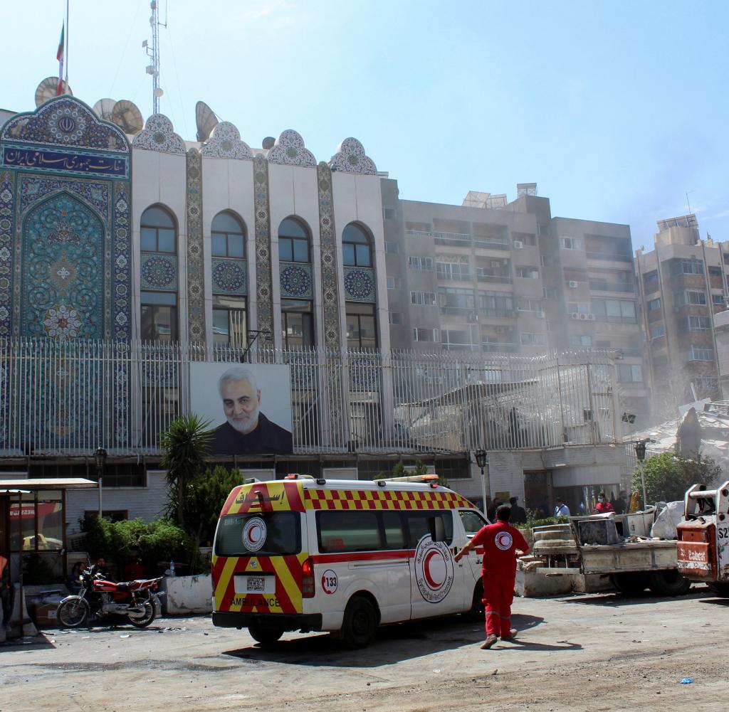 An ambulance is parked in front of the Iranian embassy building in Damascus