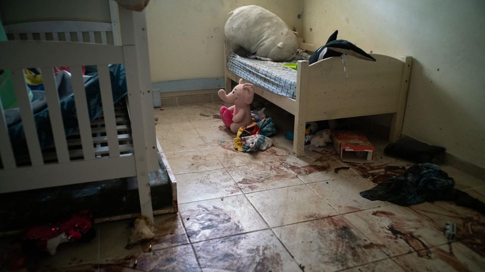 There is dried blood on the floor of a children's room in Kibbutz Be'eri