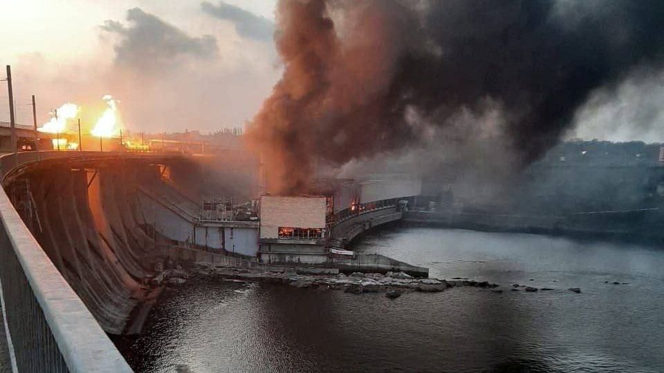 Smoke and fire after a rocket explosion at Ukraine's largest dam, the DniproHES.  The machine hall is said to be completely destroyed.