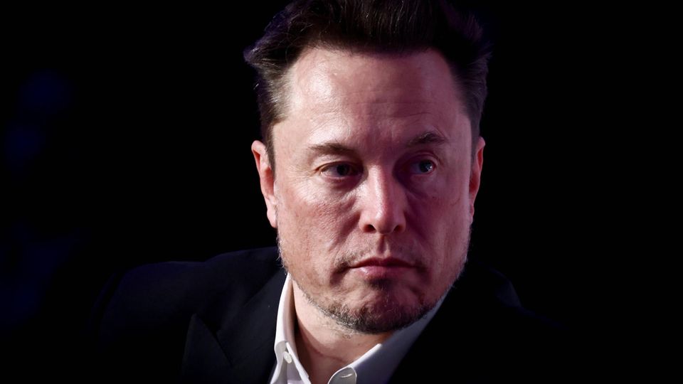 Elon Musk against a black background
