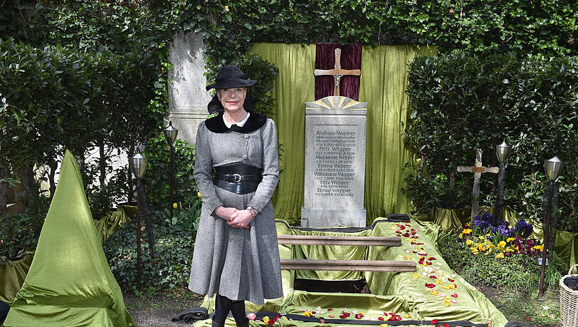 Barbara Engel poses in front of the Wepper family grave