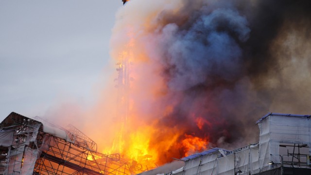 Denmark: Firefighting efforts are made more difficult by all the scaffolding around the building, which is currently being renovated.