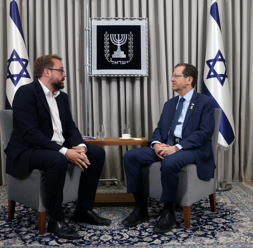Israel's President Yitzchak Herzog (right) in conversation with Paul Ronzheimer