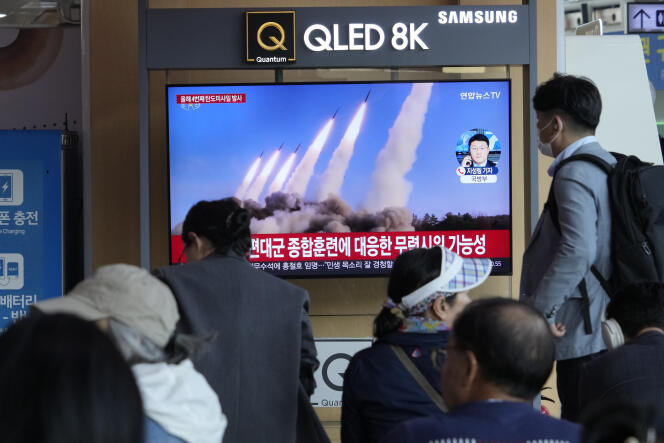 A television news broadcast shows North Korea's missile launch at Seoul Station, South Korea, April 22, 2024.