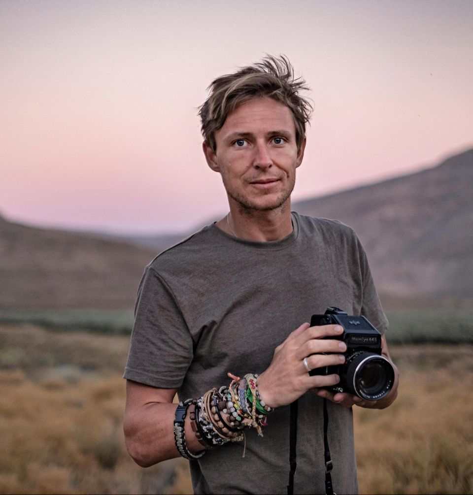 Portrait of British photographer Tommy Trenchard at work in South Africa